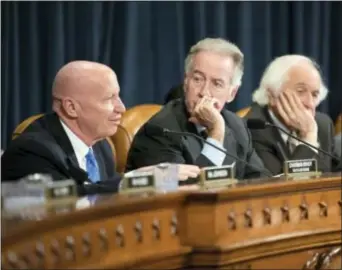  ?? J. SCOTT APPLEWHITE — THE ASSOCIATED PRESS ?? House Ways and Means Committee Chairman Kevin Brady, R-Texas, left, joined by Rep. Richard Neal, D-Mass., the ranking member, and Rep. Sander Levin, D-Mich., offers his manager’s amendment as the GOP tax bill debate enters the final stage, on Capitol...