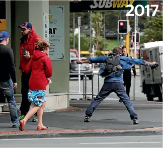  ??  ?? January 2017: A pedestrian braces himself against a gale, as winds of up to 120km hit the city.