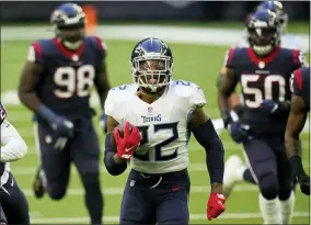  ?? MATT PATTERSON - THE ASSOCIATED PRESS ?? FILE - In this Jan. 3, 2021, file photo, Tennessee Titans running back Derrick Henry (22) carries the ball for a touchdown during an NFL football game against the Houston Texans in Houston.