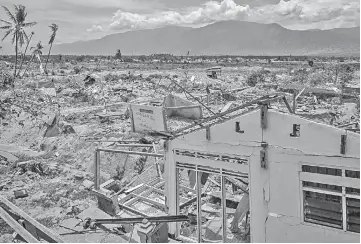  ??  ?? File photo shows an area in Palu, central Sulawesi severely damaged during a magnitude 7.5 quake and subsequent tsunami on Sept 28 last year. — AFP photos