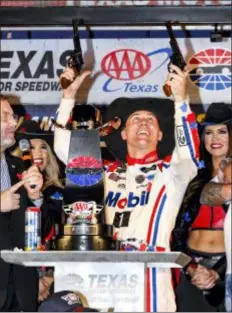  ?? LARRY PAPKE — THE ASSOCIATED PRESS ?? Kevin Harvick celebrates in Victory Lane after winning a NASCAR Cup race at Texas Motor Speedway, Sunday in Fort Worth, Texas.