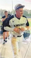  ?? MATT MURSCHEL/ORLANDO SENTINEL ?? UCF outfielder John Rhys Plumlee prepares to leave John Euliano Park during the seventh inning Friday night and make his way over to FBC Mortgage Stadium to quarterbac­k the Knights in the spring football game.