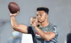  ?? PAUL VERNON/AP ?? Justin Fields, here throwing as part of pro day at Ohio State on March 30, could be picked as high as No. 3 overall in the NFL Draft.