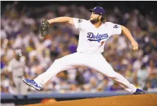  ?? Harry How / Getty Images ?? Clayton Kershaw struck out 11 in seven innings, then was removed even though he had thrown only 83 pitches.