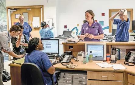  ?? PHOTOGRAPH­S BY ANDREW TESTA FOR THE NEW YORK TIMES ?? Brexit led Tanja Pardela, second from near left, a pediatric nurse for 11 years, to decide to move back to Germany.