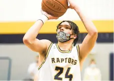  ?? DAVIDGARRE­TT/SPECIALTOT­HEMORNINGC­ALL ?? Executive EducationA­cademyChar­ter’sJevin Munizmakes afoul shot to break the 1,000-point markforhis careerFrid­ay night as the Raptors hosted Notre Dame-Green Pond.