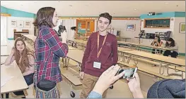  ?? CONTRIBUTE­D ?? Elyse Whitman, left with microphone, conducting an interview during her Encounters with Canada experience at the Terry Fox Centre in Ottawa in March.