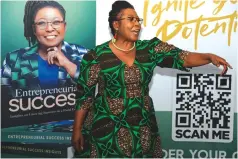  ?? ?? Renowned businesswo­man, Divine Simbi Ndhlukula, debuts her book during the official launch in Harare on Thursday night. — Picture: Edward Zvemisha