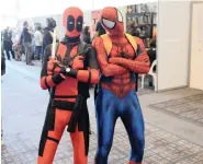  ?? PICTURE: BHEKI RADEBE ?? CHARM OFFENSIVE? Deadpool and Spider-Man cosplayers at the Cape Town Fan Con at the CTICC. The event is a celebratio­n of everything geeky, hosting entertainm­ent for all lovers of comics and geek and pop culture.