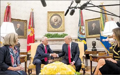  ?? AP/ANDREW HARNIK ?? President Donald Trump meets Friday in the Oval Office with Australian Prime Minister Malcolm Turnbull, accompanie­d by Turnbull’s wife, Lucy, and first lady Melania Trump.