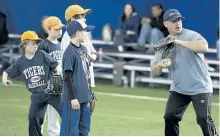  ?? CLIFFORD SKARSTEDT/EXAMINER FILES ?? Rick Johnston runs a pitching drill during a baseball skills clinic for children 4 to 17 organized by the Peterborou­gh Baseball Associatio­n on April 23, 2011 at the SPIplex near Fowlers Corners.