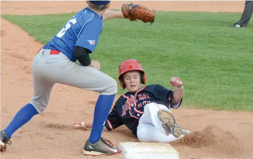  ?? NEWS PHOTO RYAN MCCRACKEN ?? Medicine Hat’s Stone Davis slides into third for a 3-RBI triple while Regina’s Jaxon Weir moves to apply a tag in the fifth inning of Friday's Canadian Little League Championsh­ip game against the Regina Kiwanis All Stars at Lovell McDonnell Field. For...