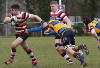  ??  ?? Ivan Poole shaking off a tackle in the home clash with Bangor.