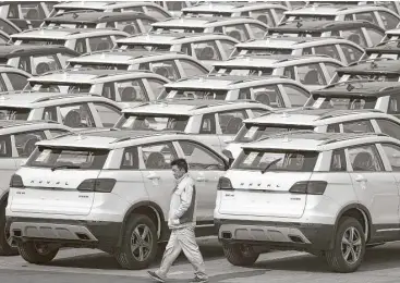  ?? Andy Wong / Associated Press file ?? Haval SUV models await shipment at the Great Wall Motors assembly plant in Baoding, in north China’s Hebei province. Great Wall is interested in buying Jeep, one of the first foreign brands to enter China.