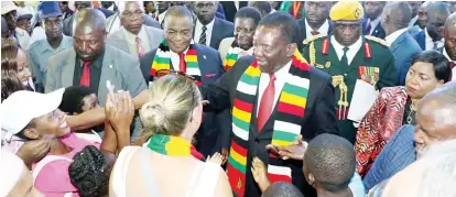  ??  ?? President Mnangagwa and VP Chiwenga mingle with members of the public in this file photo
