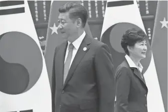  ?? POOL PHOTO BY HOW HWEE YOUNG ?? China’s Xi Jinping and South Korea’s Park Geun Hye at September’s G- 20 Summit. South Korea’s trade with China creates over- dependence worries.
