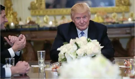  ?? PHOTO: SUSAN WALSH/AP ?? CRITICS COME TO THE TABLE: Looking like a winner, Donald Trump hosts House and Senate leaders in the White House. House Speaker Paul Ryan, who has slammed Mr Trump on numerous occasions, is on the President’s left.