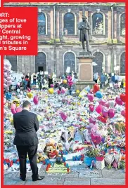  ??  ?? ®Ê SUPPORT: Messages of love from worshipper­s at Manchester Central Mosque. Right, growing sea of floral tributes in city’s St Ann’s Square