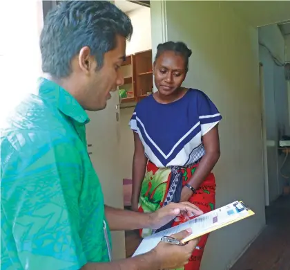  ?? Photo: Jone Salusalu ?? Fijian Competitio­n and Consumer Commission officer noting tenant Dorah Yaviong’s feedback on April 14, 2023.