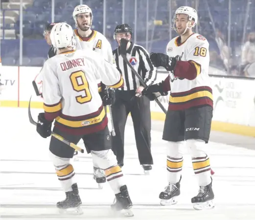  ?? CHICAGO WOLVES ?? Wolves forward Nicolas Roy (right) celebrates one of his three goals Tuesday with teammate Gage Quinney at Allstate Arena.