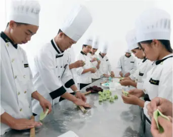  ??  ?? Students at a vocational high school in southwest China’s Yunnan Province learn how to make flour-based dishes on April 24, 2019