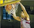  ?? TONY AVELAR — THE ASSOCIATED PRESS ?? Stanford forward Spencer Jones dunks against No. 24 UCLA during the first half in Santa Cruz on Saturday.