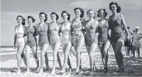  ??  ?? Young women model the latest swimwear in 1939 on the beach at Southport.