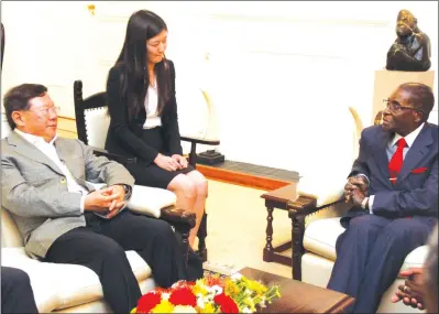  ?? — (Picture by Tawanda Mudimu) ?? President Mugabe meets R and F company president Mr Zhang Li, who was in the company of an interprete­r Ms Yi Chen at State House in Harare yesterday.