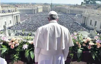  ?? L’osservator­e Romano / EPA ?? Pope Francis on the balcony of Saint Peter’s Basilica during his Easter Urbi et Orbi blessing at the Vatican, Rome.