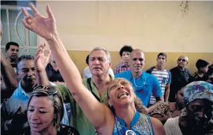  ?? AP ?? Evangelica­ls pray and cry during a service on Sunday in memory of those who died in Cuba’s worst air disaster in 30 years.