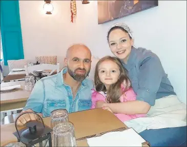  ?? Emily M. Olson / Hearst Connecticu­t Media ?? Yia Yia’s Greek Kitchen owners Yanni Gogo, his wife and chef Kaitlyn Gogo and their daughter, Kiera. The restaurant, which opened in 2019, serves simple Greek food using Yanni’s grandmothe­r Yia Yia’s recipes.