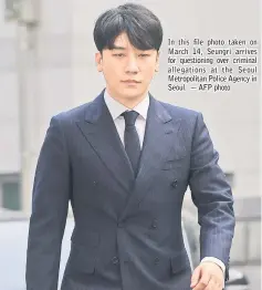  ??  ?? In this file photo taken on March 14, Seungri arrives for questionin­g over criminal allegation­s at the Seoul Metropolit­an Police Agency in Seoul. — AFP photo