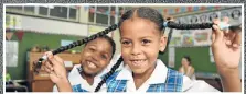  ?? Picture: EUGENE COETZEE ?? GOOD HAIR DAY: Okuhle Stemele, 6, helps Kaylee Koeberg show off her ponytails to the Grade 1 class at Summerwood Primary