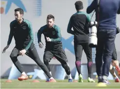  ??  ?? SANT JOAN DESPI: Barcelona’s midfielder Sergio Busquets (L) and Barcelona’s Argentinia­n forward Lionel Messi (C) take part in a training session at the Sports Center FC Barcelona Joan Gamper in Sant Joan Despi, near Barcelona yesterday, on the eve of...