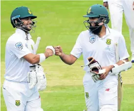  ?? /Lee Warren/Gallo Images ?? Ton-up boys: JP Duminy, left, and Hashim Amla put on a 292 third-wicket partnershi­p at the Wanderers on Thursday.