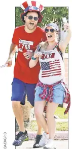  ??  ?? Spencer Pratt and pregnant wife Heidi Montag celebrate July Fourth with a fun run in LA.