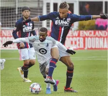  ?? STAFF PHOTOS BY CHRIS CHRISTO ?? TOWERING OVER THE COMPETITIO­N: Revolution forward Juan Agudelo (above) battles Minnesota United’s Mohammed Saeid for the ball yesterday at Gillette Stadium, while Chris Tierney (left) celebrates after scoring from the penalty spot in the 53rd minute,...