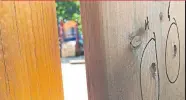  ??  ?? Bullet holes mark a fence near the playground where two young girls were shot and wounded Thursday in Scarboroug­h.