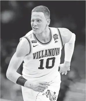  ??  ?? Donte DiVincenzo scored 31 points off the bench to lead Villanova to a second national title in three years. BOB DONNAN/USA TODAY SPORTS