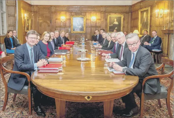  ??  ?? Theresa May holding an away-day with her Ministers at Chequers. It has been argued that they would be far better occupied having an away-day with their letters.