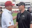  ??  ?? Southern Cal coach Clay Helton, left, and Western Michigan’s Tim Lester made a plan.