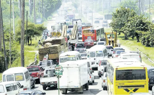  ?? FILE PHOTO ?? Most cities today have developed around the car. Many people live in one area, commute to work somewhere else, and go shopping in a third.This increases demand for vehicles and gasoline, generates congestion and air pollution, and consumes millions of hours lost while sitting in traffic.