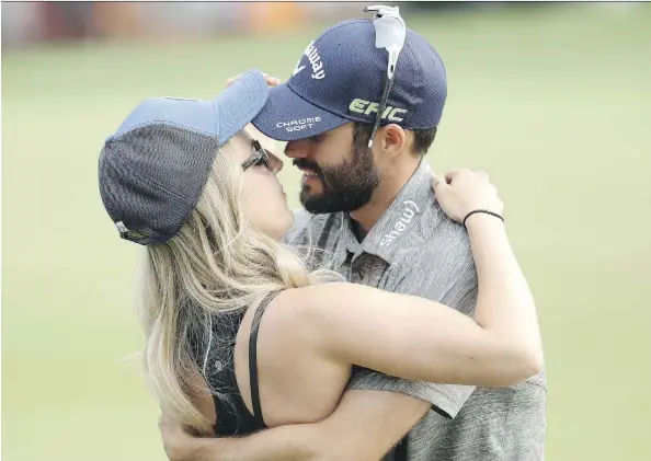  ?? MIKE LAWRIE/GETTY IMAGES ?? Adam Hadwin celebrates with fiancée Jessica Kippenberg­er after winning the Valspar Championsh­ip on Sunday in Palm Harbor, Fla. The 29-year-old from Abbotsford, B.C., says he’s in “a bit of a fog” after his first win on the PGA Tour threw his short-term...
