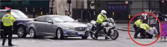  ??  ?? Crunch: The security team’s Range Rover rams into the back of the car carrying Boris Johnson yesterday as, circled, police tackle the activist who ran into the road