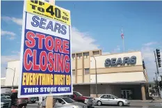  ?? SCOTT OLSON/GETTY IMAGES ?? A sign announcing a store-closing sale is seen at a Chicago Sears store earlier this month. An Ontario court ruled Tuesday that Sears stores in Canada slated for closure can begin ‘Everything Must Go’ sales this week. The chain is to shutter 59 stores...