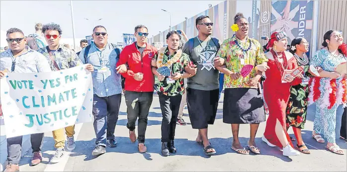  ?? Picture: DOMINIKA ZARZYCKA/AFP ?? Pacific Islands activists protest demanding climate action and loss and damage reparation­s at COP27 in Egypt.