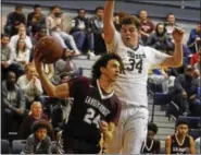  ?? DAVID M. JOHNSON - DJOHNSON@DIGITALFIR­STMEDIA.COM ?? Lansingbur­gh’s Trevor Green looks for a pass as Cohoes’ Ethan Mowers (34) defends during a Colonial Council boys basketball game Dec. 1, 2017at Cohoes High School.