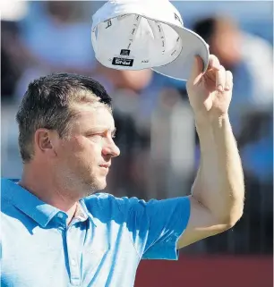  ?? CARLOS OSORIO/AP ?? Nate Lashley, who got into the Rocket Mortgage Classic as an alternate and then led start to finish, tips his cap after his birdie on the 17th hole Sunday.