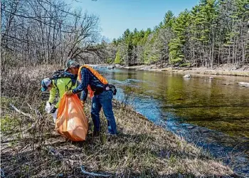  ?? John DiGiacomo ?? The Ausable River Associatio­n hosts its annual Earth Day Ausable River cleanup from 10 a.m. to 1 p.m. Saturday, April 20.