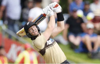  ?? Picture: AFP ?? HUGE. New Zealand opener Martin Guptill smashes a six during the second Twenty20 internatio­nal against Australia in Dunedin yesterday.